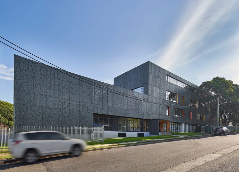 The school's perforated facade from the front entrance