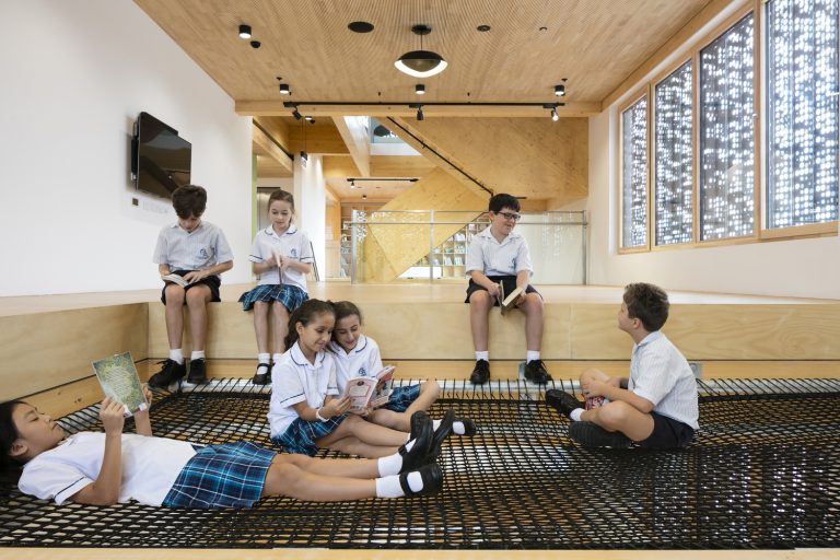 The school library features a suspended reading pit