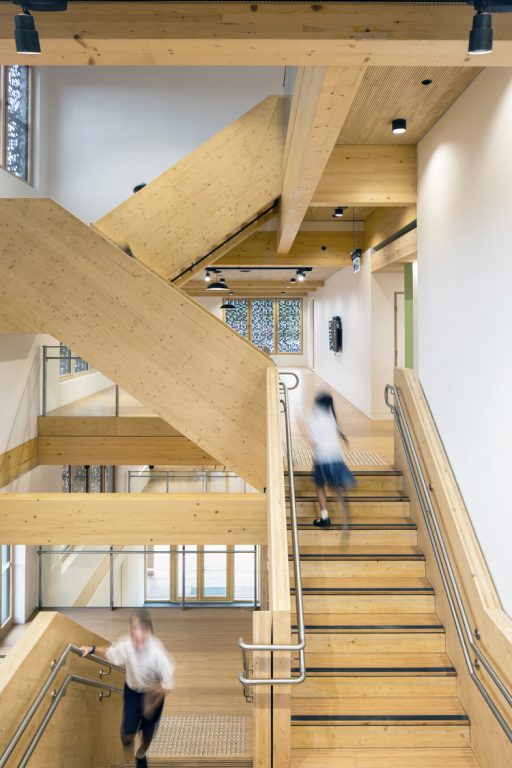 The atrium stairs connect all levels of the four-storey building